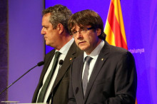 El president de la Generalitat, Carles Puigdemont, i el conseller d'Interior, Joaquim Forn