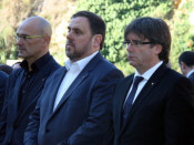 Carles Puigdemont, amb Oriol Junqueras i Raül Romeva