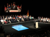 Imatge general de l'acte al TNC durant la intervenció del president de la Generalitat, Carles Puigdemont, amb les urnes a un costat