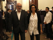 El president del grup parlamentari de JxSí, Lluís Corominas, i la portaveu, Marta Rovira, es dirigeixen a la reunió que el grup ha celebrat abans del ple