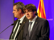 El president de la Generalitat, Carles Puigdemont, i el conseller d'Interior, Joaquim Forn